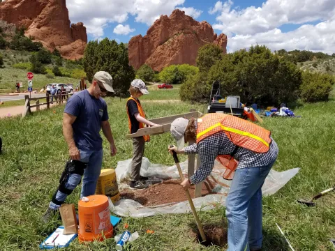 anthropology students working in field